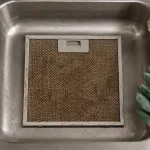 Nettoyage grille hotte grasse, trempage à 60 °C